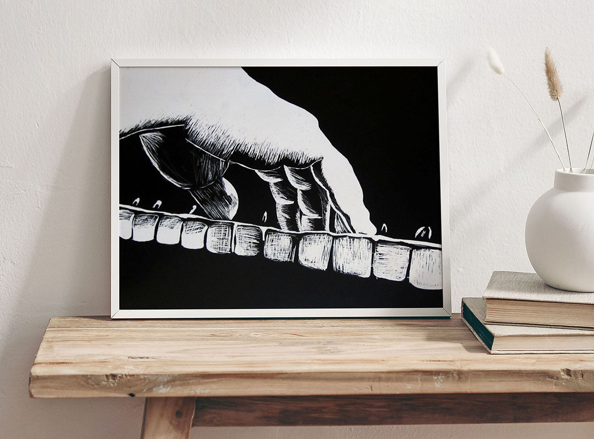 Black and white scratchboard-style artwork of a pianist’s hand pressing piano keys, with bold line texture on a black background.