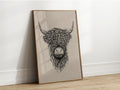 Intricate black and white illustration of a Highland Cattle head, showcasing its long, shaggy hair and prominent horns.