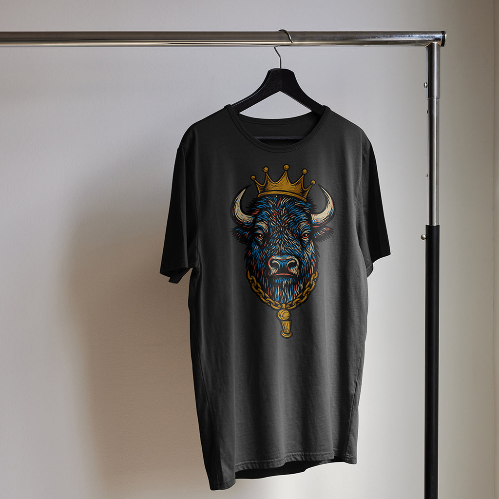 Black t-shirt with a colorful bull graphic on a hanger against a neutral background