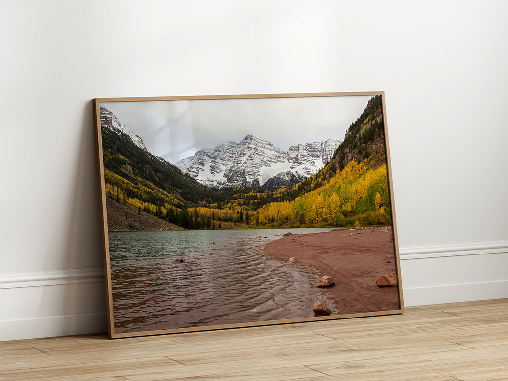 Stunning landscape artwork featuring a serene lake reflecting snow-capped mountains and vibrant golden aspen trees in autumn.