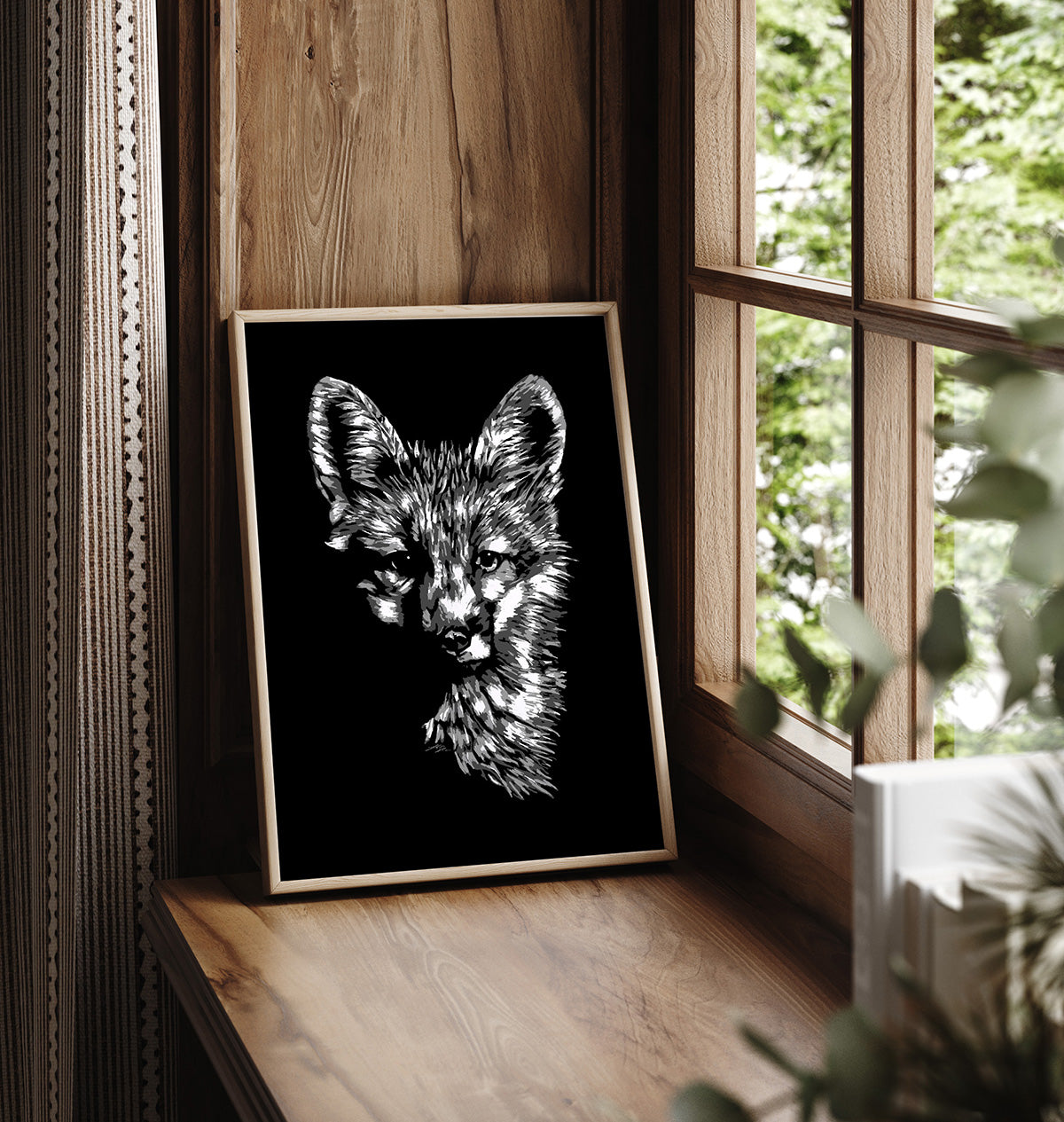 A black and white artistic portrait of a fox, presented as fine art print in a wooden frame.