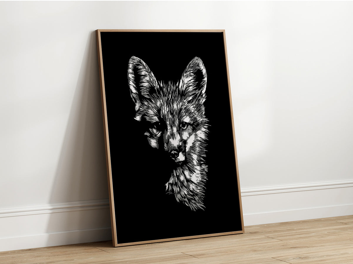 A black and white artistic portrait of a fox, presented as fine art print in a wooden frame.
